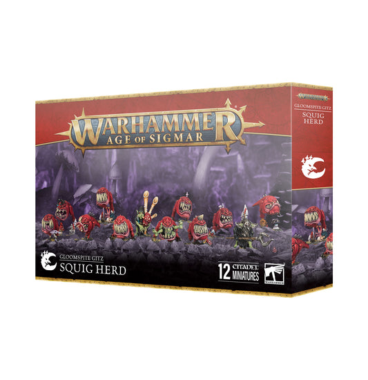 A group of Gloomspite Gitz Squig Herd miniatures by Games Workshop, featuring colorful squigs and goblin-like creatures on a display base.
