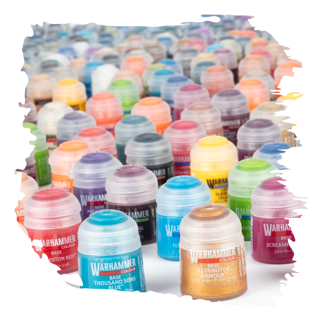 Collection of Warhammer paint bottles in various colors on a white background